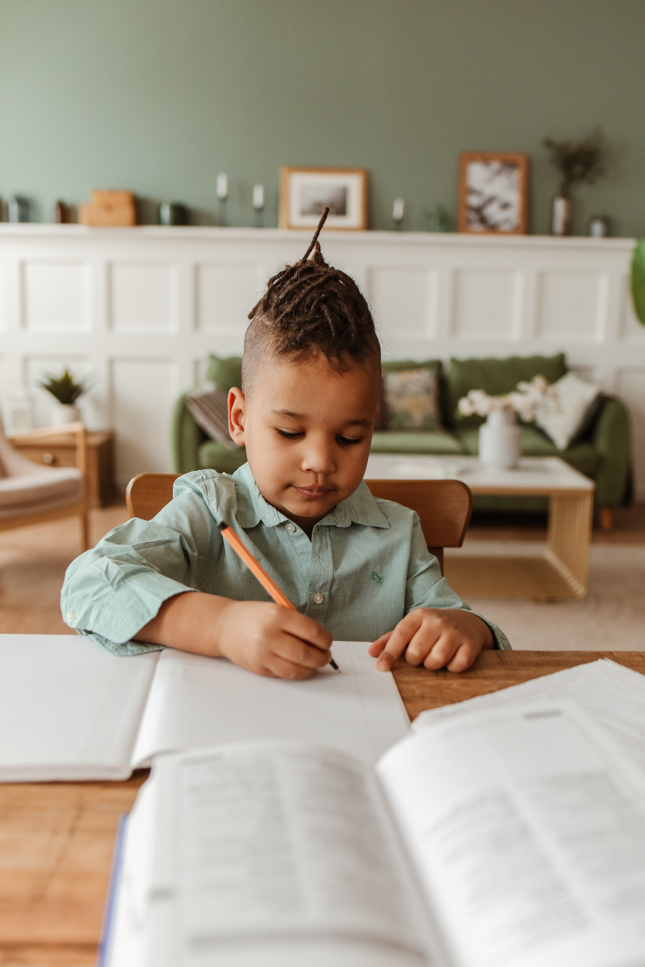 Young Boy Doing Homework at Home